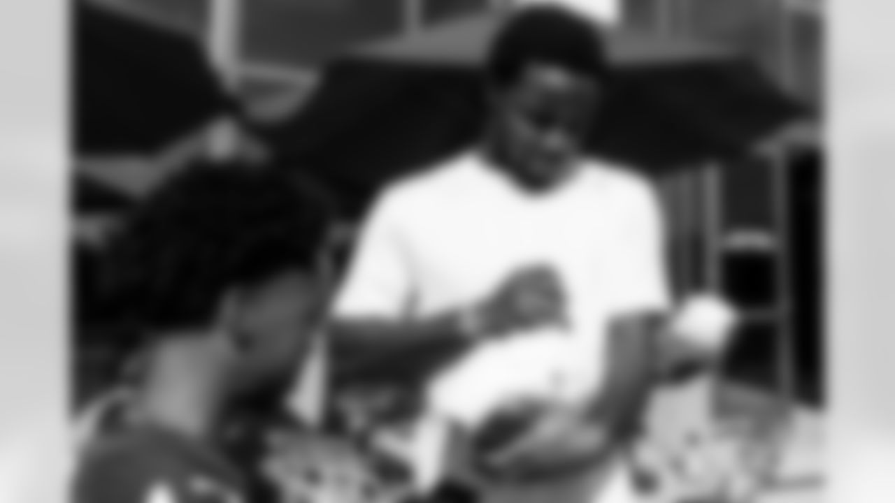 TAMPA, FL - December 05, 2025 - Mike and Ashli Evans host the Mike Evans Family Foundation 'Catch for Christmas' holiday event at AdventHealth Training Center. Photo By Kyle Zedaker/Tampa Bay Buccaneers