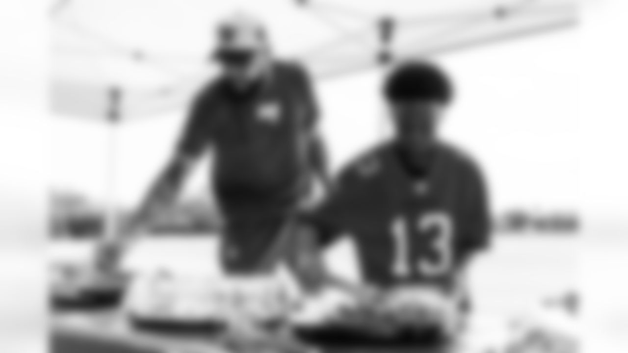 TAMPA, FL - December 05, 2025 - Mike and Ashli Evans host the Mike Evans Family Foundation 'Catch for Christmas' holiday event at AdventHealth Training Center. Photo By Kyle Zedaker/Tampa Bay Buccaneers