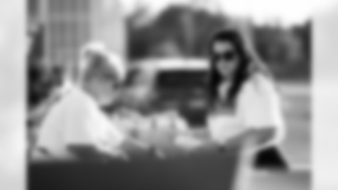 TAMPA, FL - November 25, 2025 - Volunteers during Turkey Time with the O-Line. Photo By Kyle Zedaker/Tampa Bay Buccaneers