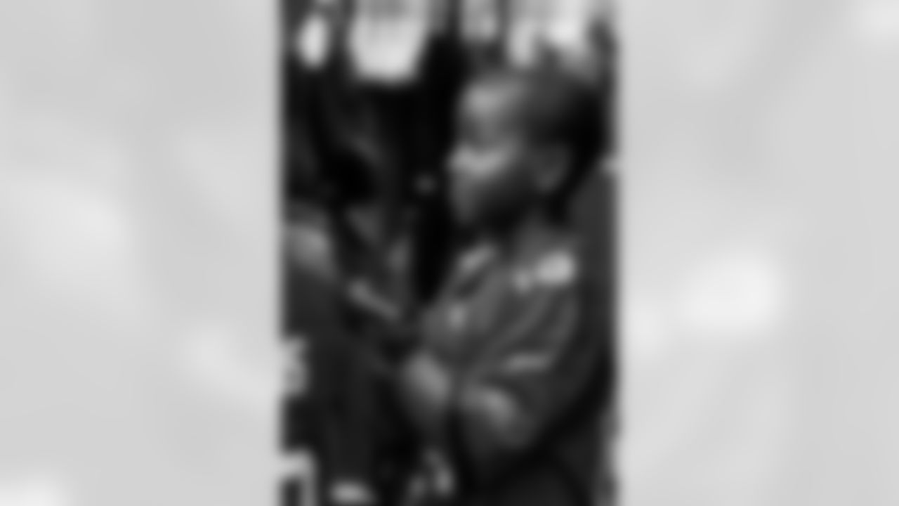 TAMPA, FL - December 05, 2025 - Mike and Ashli Evans host the Mike Evans Family Foundation 'Catch for Christmas' holiday event at AdventHealth Training Center. Photo By Kyle Zedaker/Tampa Bay Buccaneers