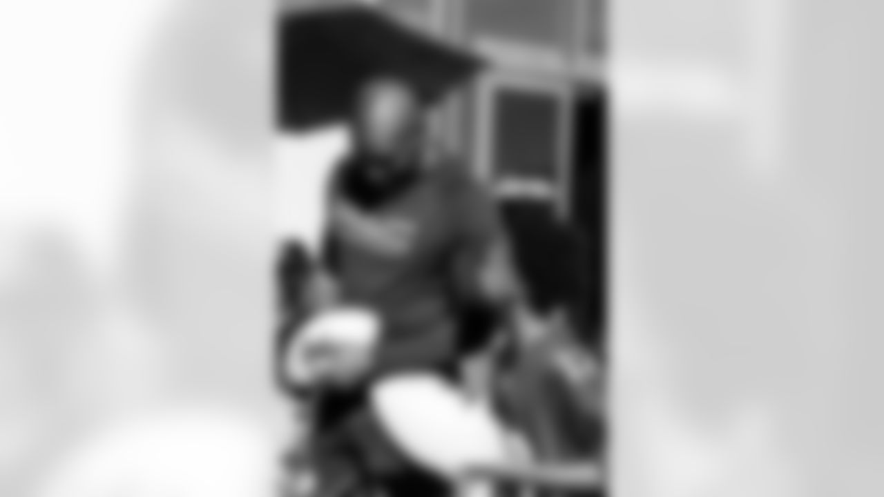 TAMPA, FL - December 05, 2025 - Mike and Ashli Evans host the Mike Evans Family Foundation 'Catch for Christmas' holiday event at AdventHealth Training Center. Photo By Kyle Zedaker/Tampa Bay Buccaneers