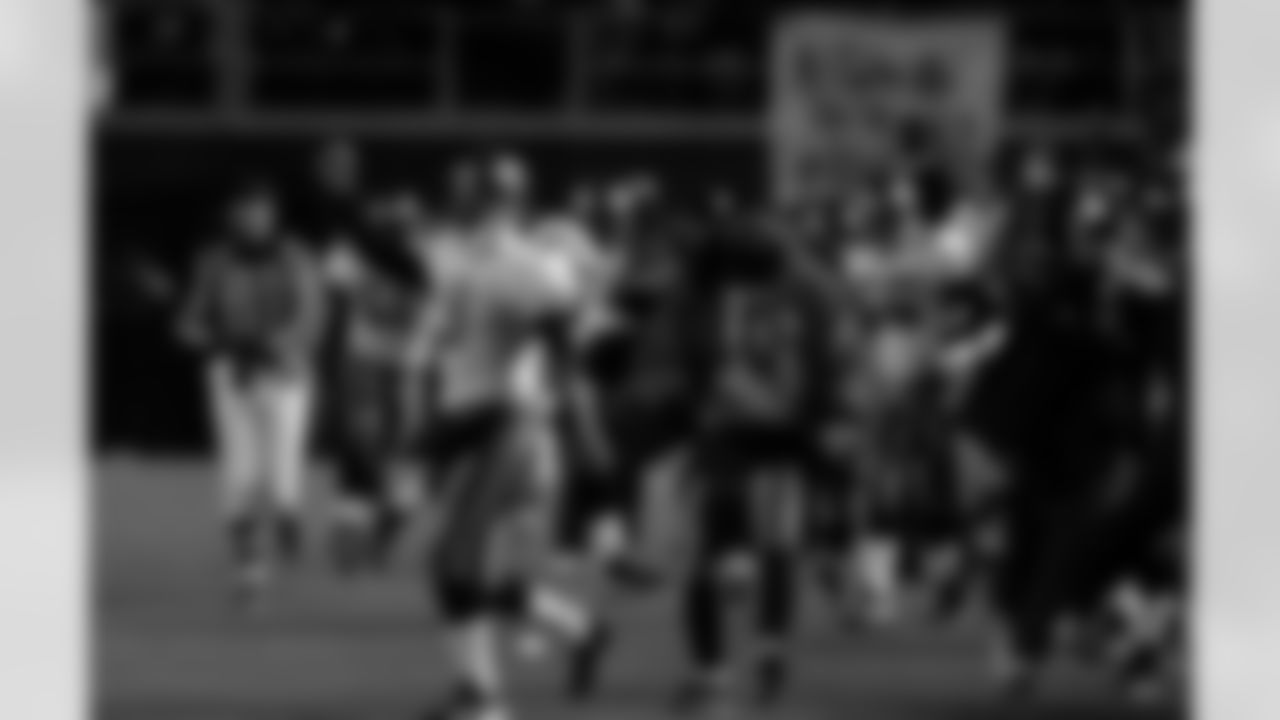 PHILADELPHIA, PA - JANUARY 19: Punter Tom Tupa #9 of the Tampa Bay Buccaneers celebrates a 92-yard interception return for a touchdown by Cornerback Ronde Barber #20 against the Philadelphia Eagles during the NFC Championship Game at Veterans Stadium on January 19, 2003 in Philadelphia, Pennsylvania. The Buccaneers won 27-10. (Tom Wagner/Tampa Bay Buccaneers)