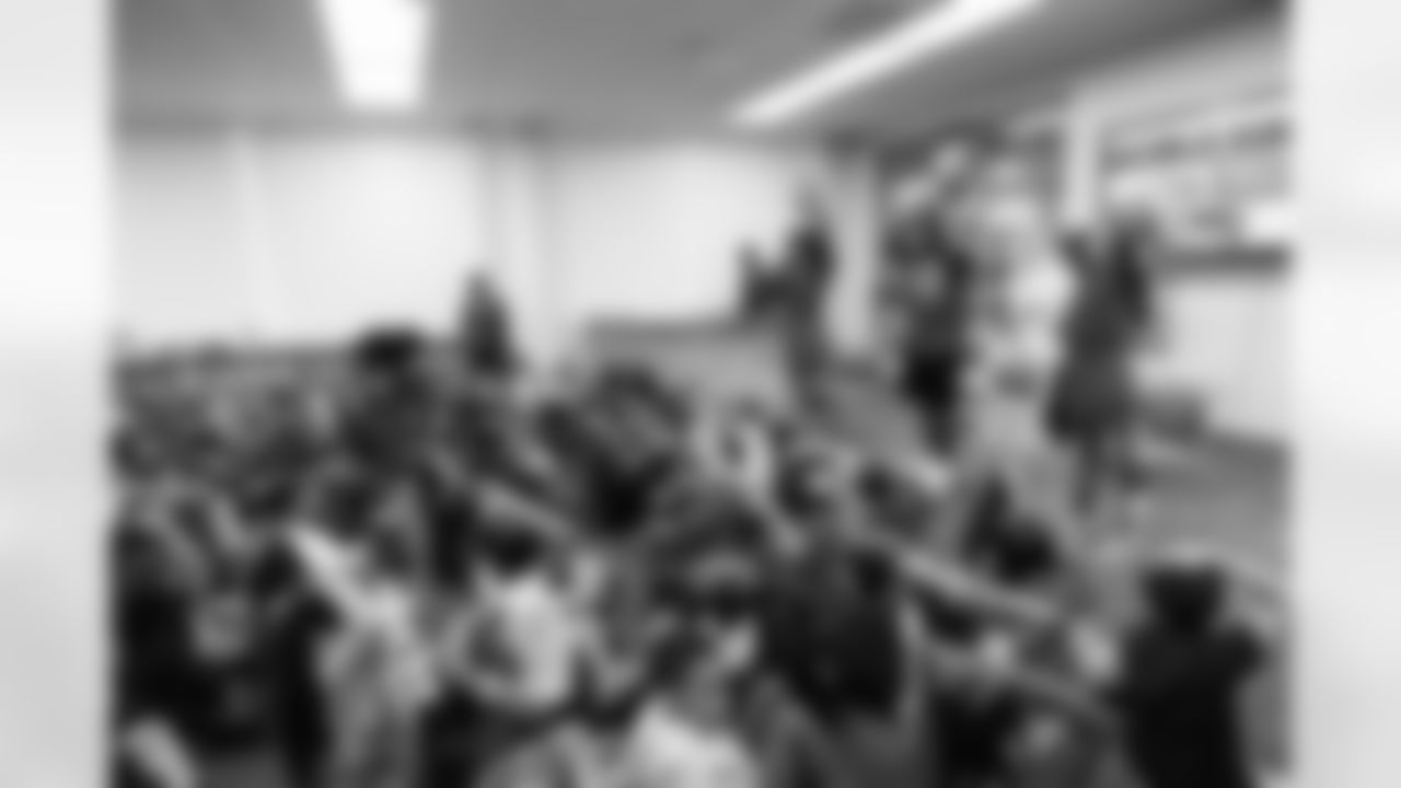 TAMPA, FL - March 03, 2026 - Safety Rashad Wisdom #38 of the Tampa Bay Buccaneers and Tampa Bay Buccaneers Cheerleaders during the National Reading Month celebration hosted by The Tampa Bay Buccaneers and Dr. Seuss Enterprises at Potter Elementary School. Photo By Doug DeFelice/Tampa Bay Buccaneers