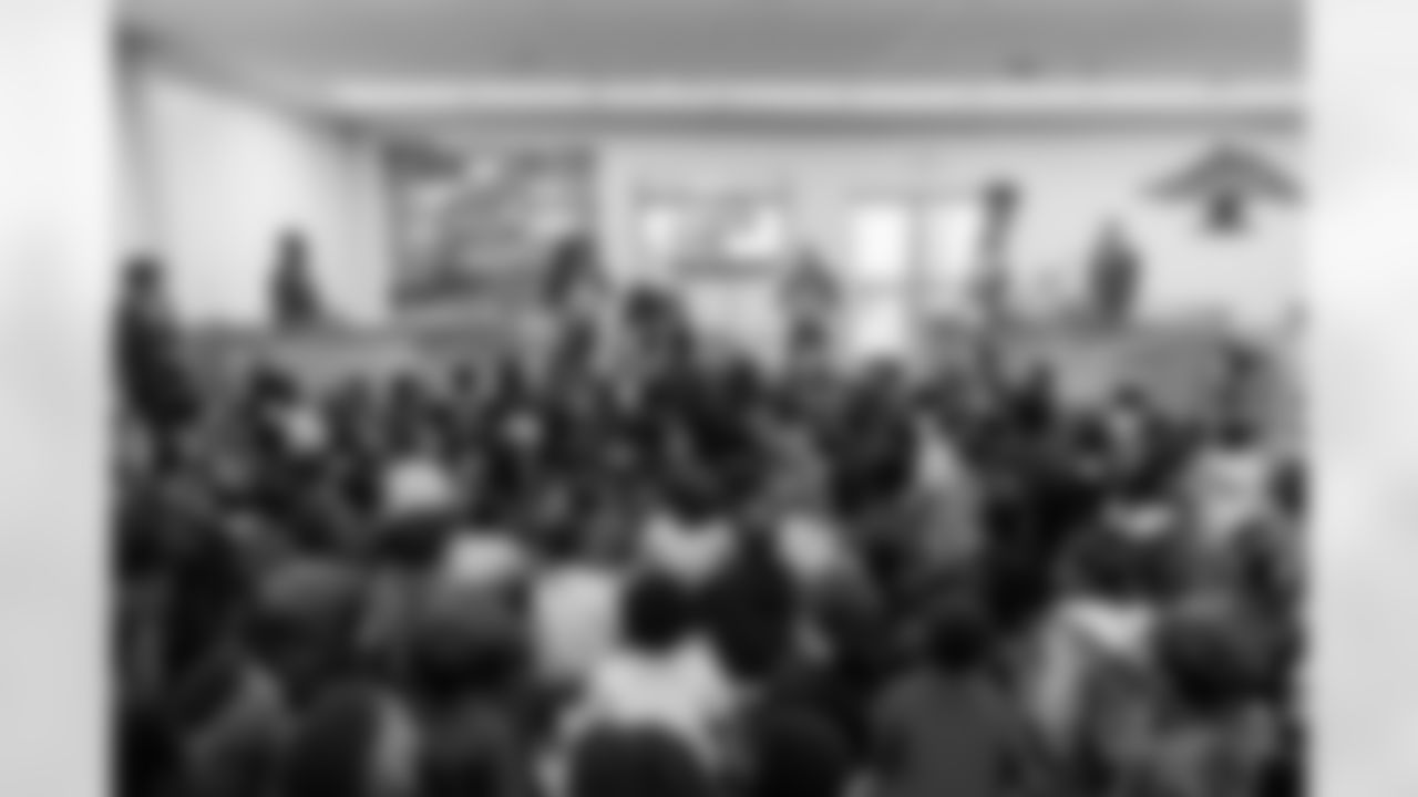 TAMPA, FL - March 03, 2026 - Safety Rashad Wisdom #38 of the Tampa Bay Buccaneers and Tampa Bay Buccaneers Cheerleaders during the National Reading Month celebration hosted by The Tampa Bay Buccaneers and Dr. Seuss Enterprises at Potter Elementary School. Photo By Doug DeFelice/Tampa Bay Buccaneers