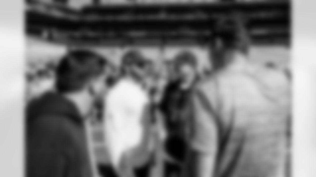 MIAMI GARDENS, FL - December 28, 2025 - Quarterback Baker Mayfield #6, Offensive Coordinator Josh Grizzard, Run Game Coordinator/Offensive Line Coach Kevin Carberry and Defensive Quality Control Coach Joey Fitzgerald of the Tampa Bay Buccaneers before the game between the Tampa Bay Buccaneers and Miami Dolphins. The Bucs lost the game, 20-17. Photo By Tori Richman/Tampa Bay Buccaneers