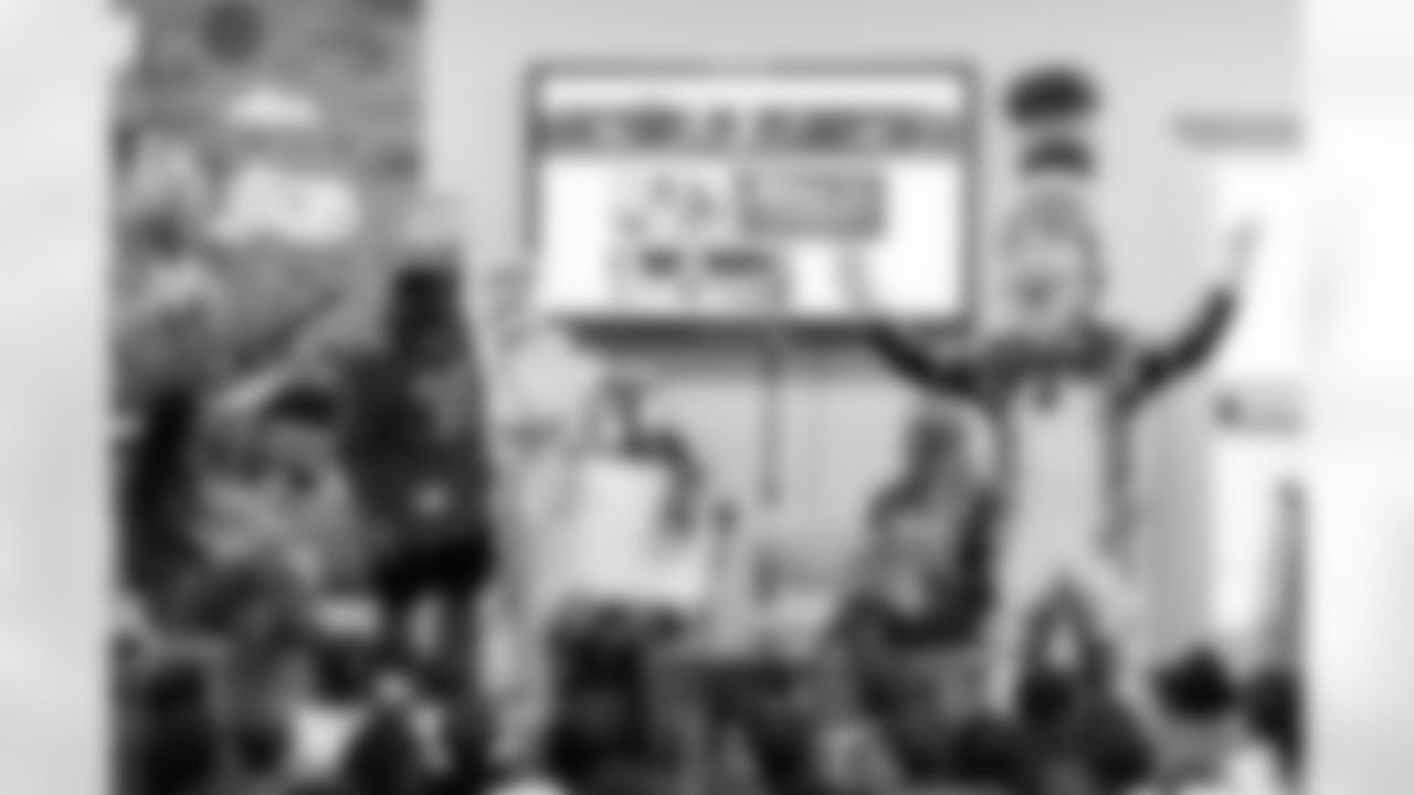 TAMPA, FL - March 03, 2026 - Safety Rashad Wisdom #38 of the Tampa Bay Buccaneers and Tampa Bay Buccaneers Cheerleaders during the National Reading Month celebration hosted by The Tampa Bay Buccaneers and Dr. Seuss Enterprises at Potter Elementary School. Photo By Doug DeFelice/Tampa Bay Buccaneers