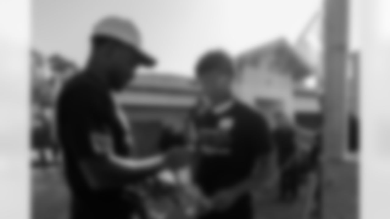 TAMPA, FL - November 18, 2025 - Cornerback Benjamin Morrison #21 and Cornerback Jacob Parrish #25 of the Tampa Bay Buccaneers during a home build with Habitat for Humanity of Tampa Bay Hillsborough. Photo By Doug DeFelice/Tampa Bay Buccaneers