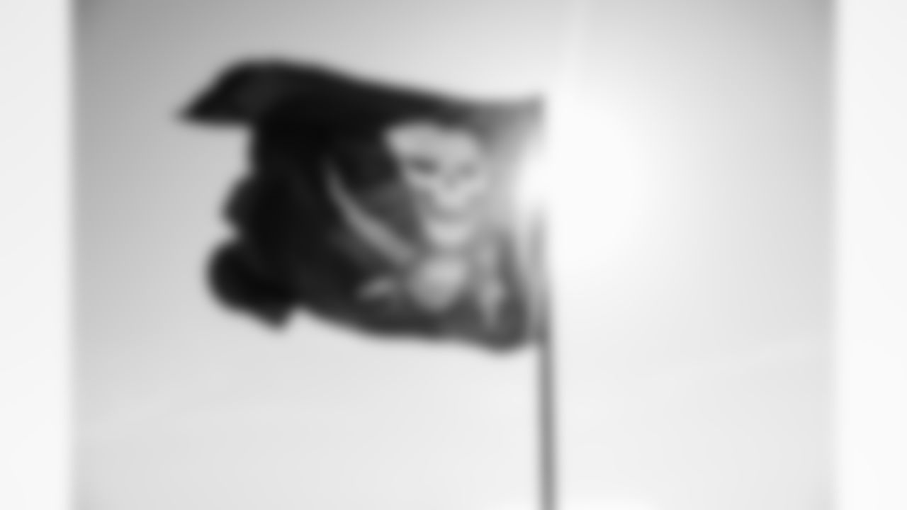 ST. PETE BEACH, FL - April 26, 2025 - Flag waving at sunset during Bucs Beach Bash. Photo By Dave Pullis/Tampa Bay Buccaneers