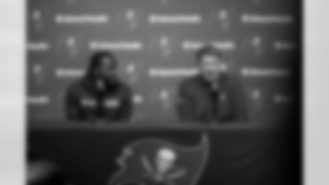 TAMPA, FL - March 22, 2024 - Inside Linebacker Lavonte David #54 of the Tampa Bay Buccaneers and General Manager Jason Licht during a press conference after he signed his contract at AdventHealth Training Center. Photo By Tori Richman/Tampa Bay Buccaneers
