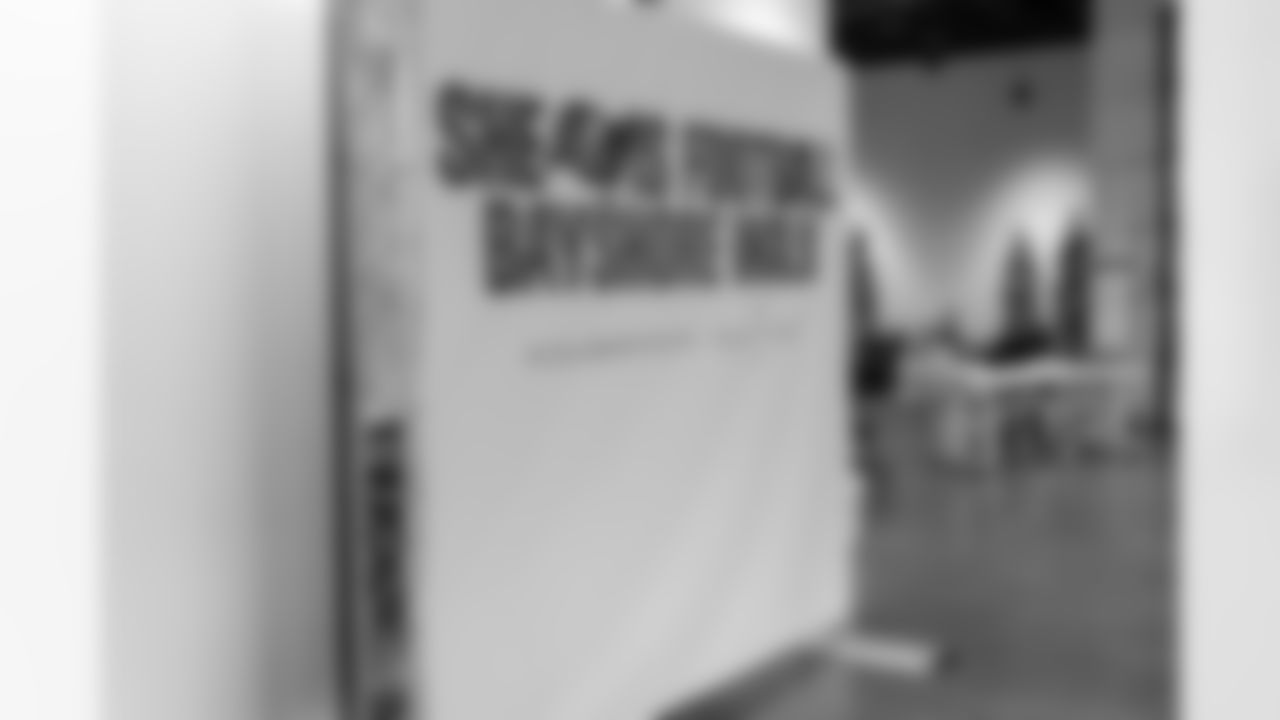 TAMPA, FL - December 06, 2025 - Set up for the She is Football Bayshore Walk: Raise The Flags event with Bayshore Breakfast Club and Tampa Girls Social & Wellness at Hyde House Public Studio. Photo By Mike Carlson/Tampa Bay Buccaneers