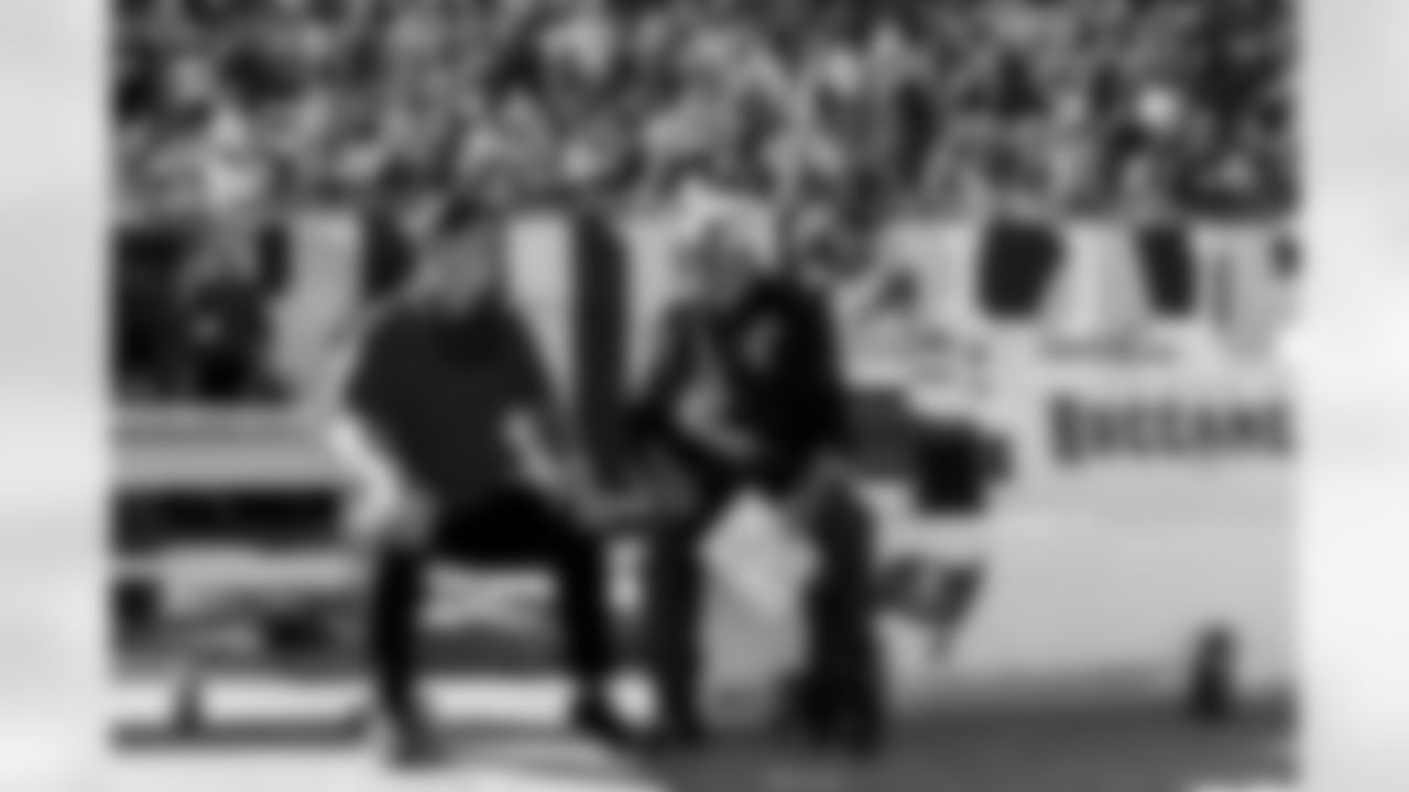 TAMPA, FL - November 30, 2025 - Senior Offensive Assistant Tom Moore of the Tampa Bay Buccaneers and Buccaneers Legend Brad Johnson during the game between the Arizona Cardinals and Tampa Bay Buccaneers. The Bucs won the game, 20-17. Photo By Tori Richman/Tampa Bay Buccaneers