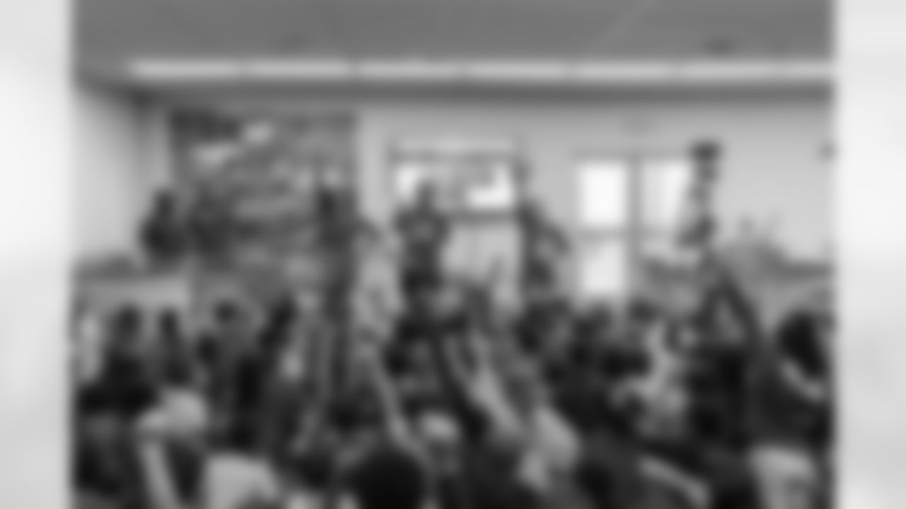 TAMPA, FL - March 03, 2026 - Safety Rashad Wisdom #38 of the Tampa Bay Buccaneers and Tampa Bay Buccaneers Cheerleaders during the National Reading Month celebration hosted by The Tampa Bay Buccaneers and Dr. Seuss Enterprises at Potter Elementary School. Photo By Doug DeFelice/Tampa Bay Buccaneers