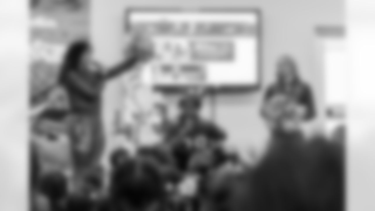 TAMPA, FL - March 03, 2026 - Safety Rashad Wisdom #38 of the Tampa Bay Buccaneers and Tampa Bay Buccaneers Cheerleaders during the National Reading Month celebration hosted by The Tampa Bay Buccaneers and Dr. Seuss Enterprises at Potter Elementary School. Photo By Doug DeFelice/Tampa Bay Buccaneers