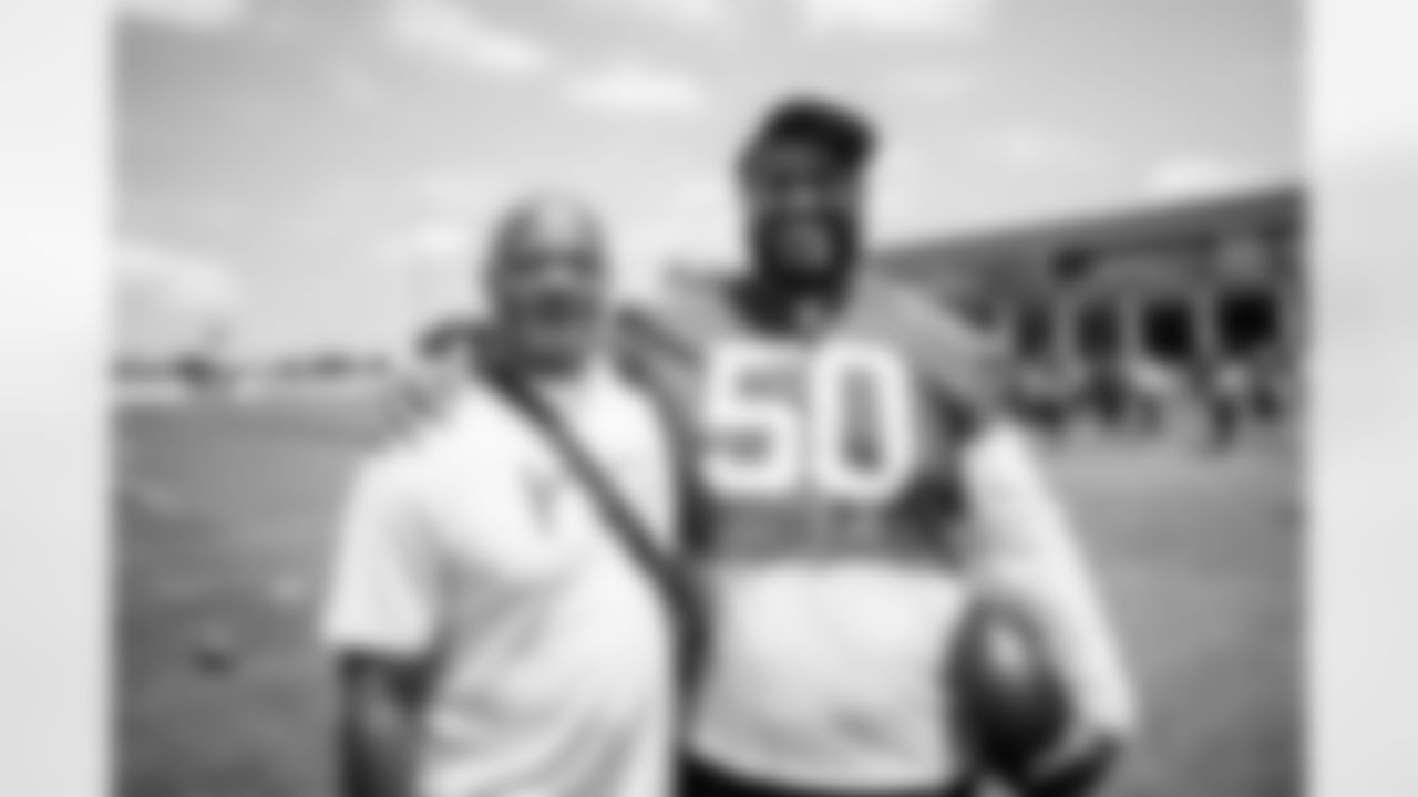 TAMPA, FL - June 03, 2025 - Defensive Tackle Vita Vea #50 of the Tampa Bay Buccaneers and Buccaneers Legend Donnie Elder during OTA's at AdventHealth Training Center. Photo By Tori Richman/Tampa Bay Buccaneers