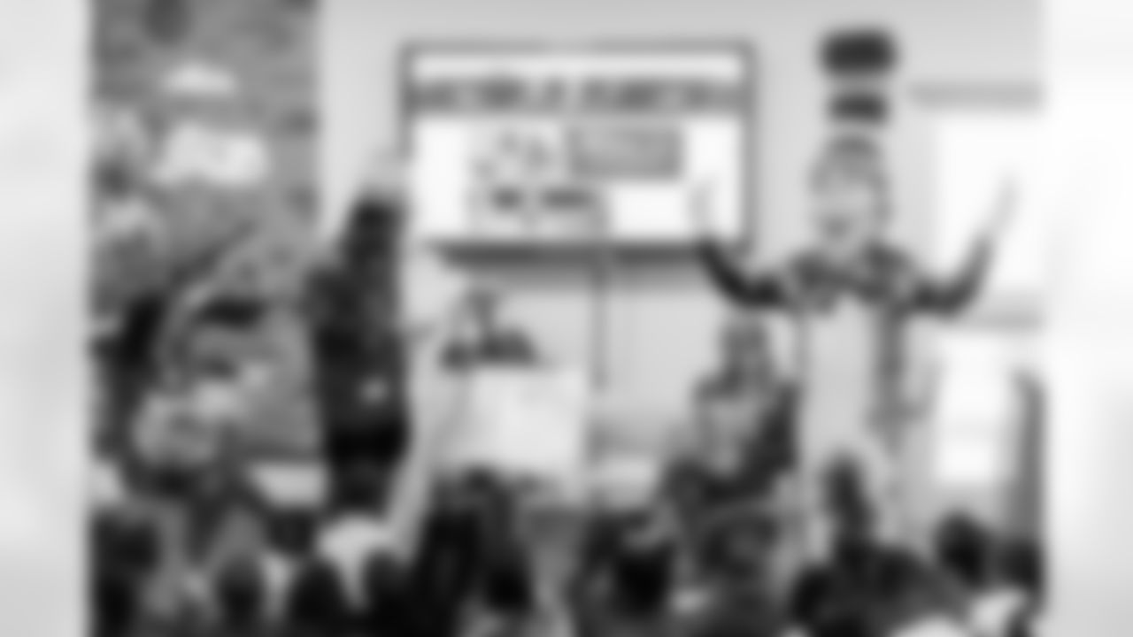 TAMPA, FL - March 03, 2026 - Safety Rashad Wisdom #38 of the Tampa Bay Buccaneers and Tampa Bay Buccaneers Cheerleaders during the National Reading Month celebration hosted by The Tampa Bay Buccaneers and Dr. Seuss Enterprises at Potter Elementary School. Photo By Doug DeFelice/Tampa Bay Buccaneers