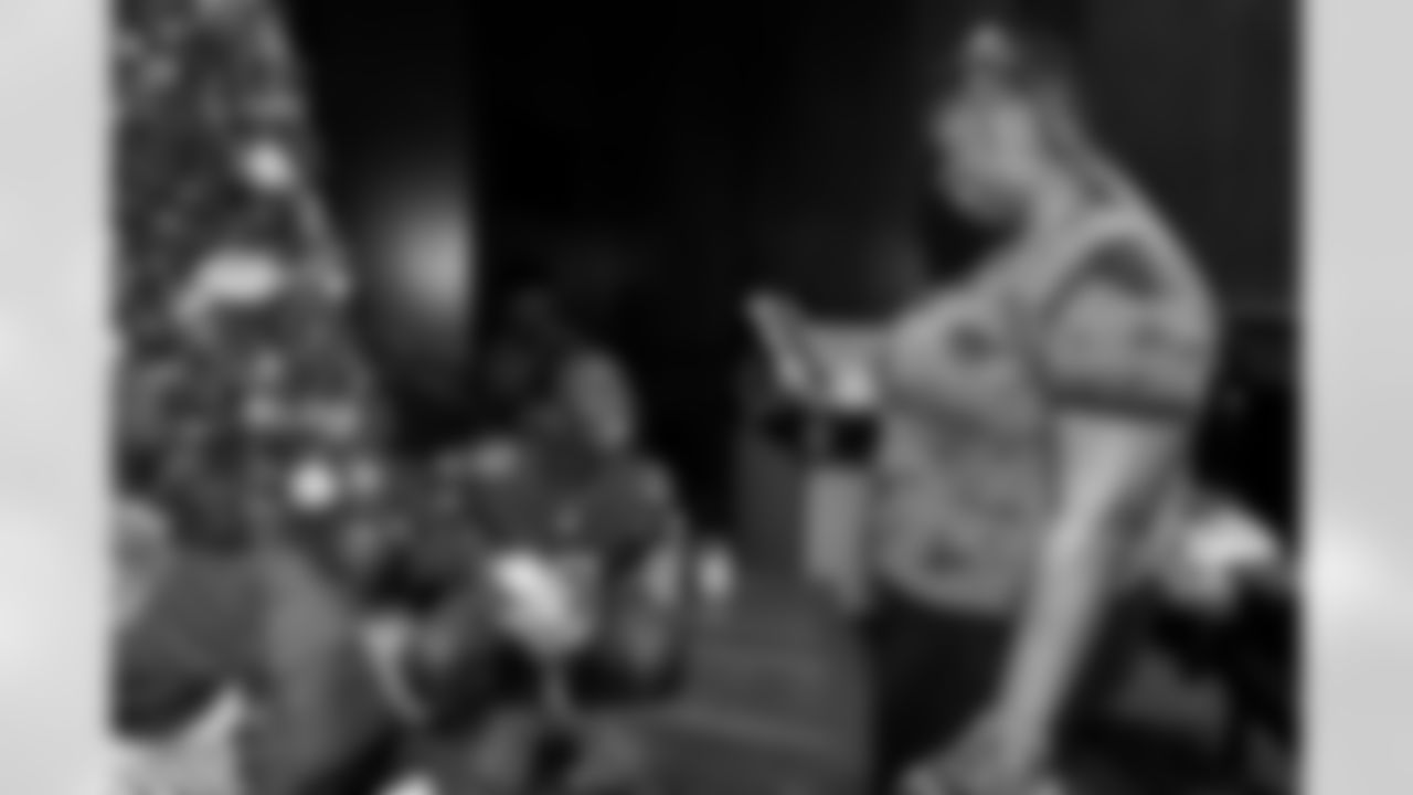 TAMPA, FL - December 05, 2025 - Mike and Ashli Evans host the Mike Evans Family Foundation 'Catch for Christmas' holiday event at AdventHealth Training Center. Photo By Kyle Zedaker/Tampa Bay Buccaneers