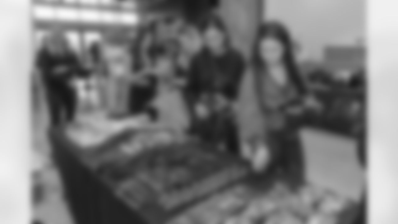 TAMPA, FL - December 06, 2025 - She is Football Bayshore Walk: Raise The Flags event with Bayshore Breakfast Club and Tampa Girls Social & Wellness at Hyde House Public Studio. Photo By Mike Carlson/Tampa Bay Buccaneers