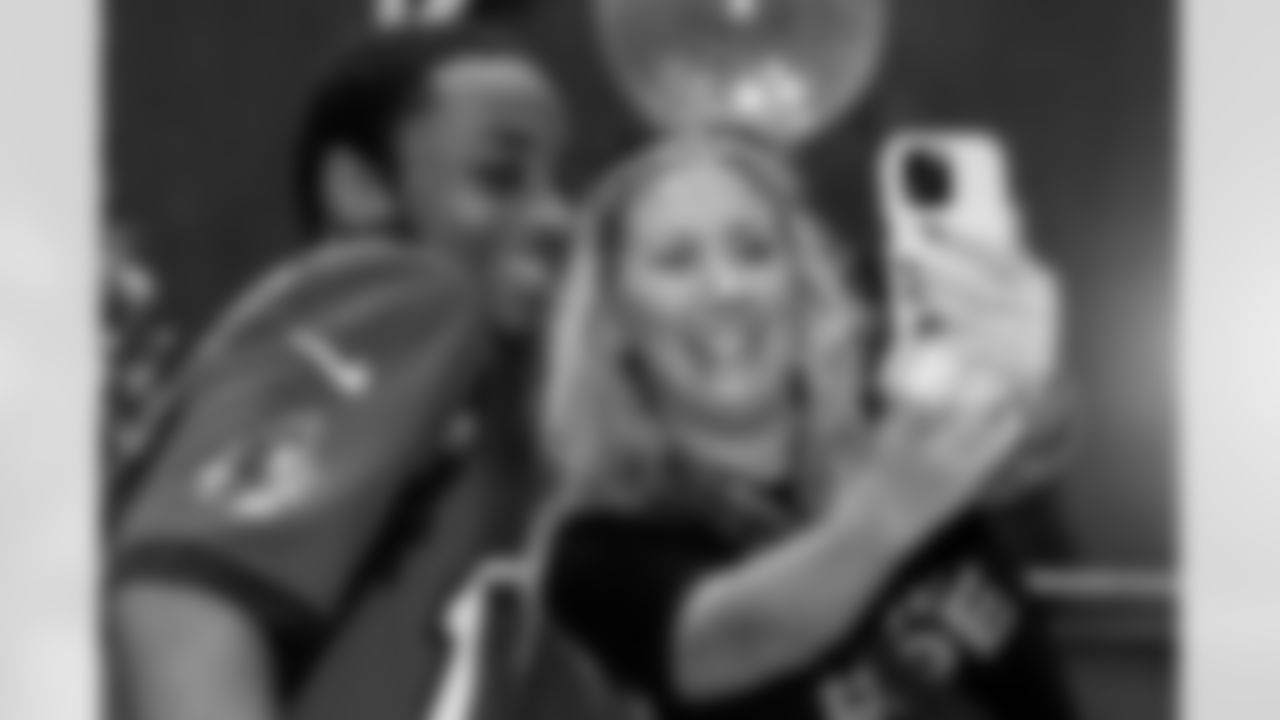 TAMPA, FL - December 05, 2025 - Mike and Ashli Evans host the Mike Evans Family Foundation 'Catch for Christmas' holiday event at AdventHealth Training Center. Photo By Kyle Zedaker/Tampa Bay Buccaneers