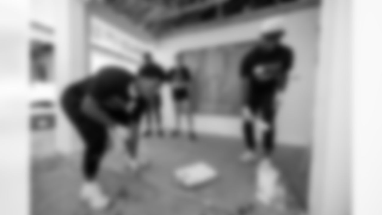 TAMPA, FL - November 18, 2025 - Cornerback Benjamin Morrison #21 and Cornerback Jacob Parrish #25 of the Tampa Bay Buccaneers during a home build with Habitat for Humanity of Tampa Bay Hillsborough. Photo By Doug DeFelice/Tampa Bay Buccaneers