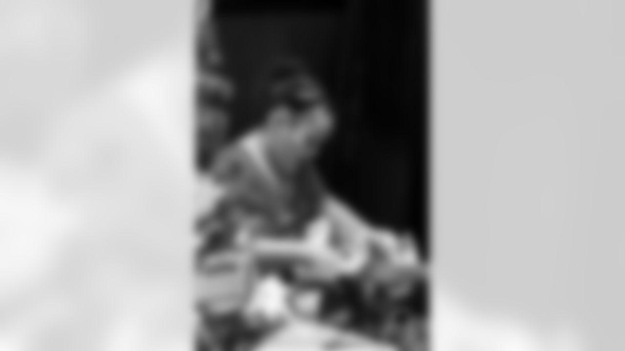 TAMPA, FL - December 05, 2025 - Mike and Ashli Evans host the Mike Evans Family Foundation 'Catch for Christmas' holiday event at AdventHealth Training Center. Photo By Kyle Zedaker/Tampa Bay Buccaneers