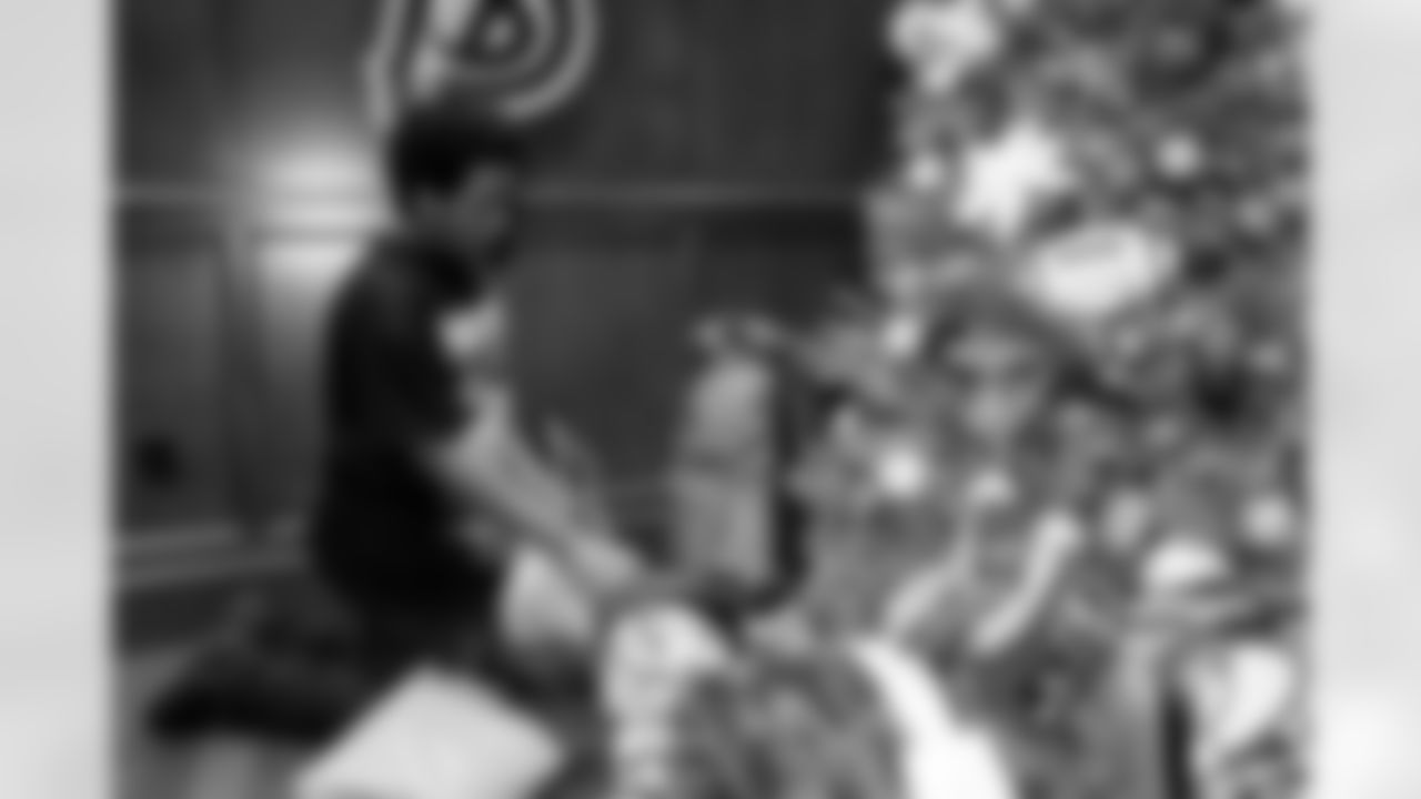 TAMPA, FL - December 05, 2025 - Mike and Ashli Evans host the Mike Evans Family Foundation 'Catch for Christmas' holiday event at AdventHealth Training Center. Photo By Kyle Zedaker/Tampa Bay Buccaneers