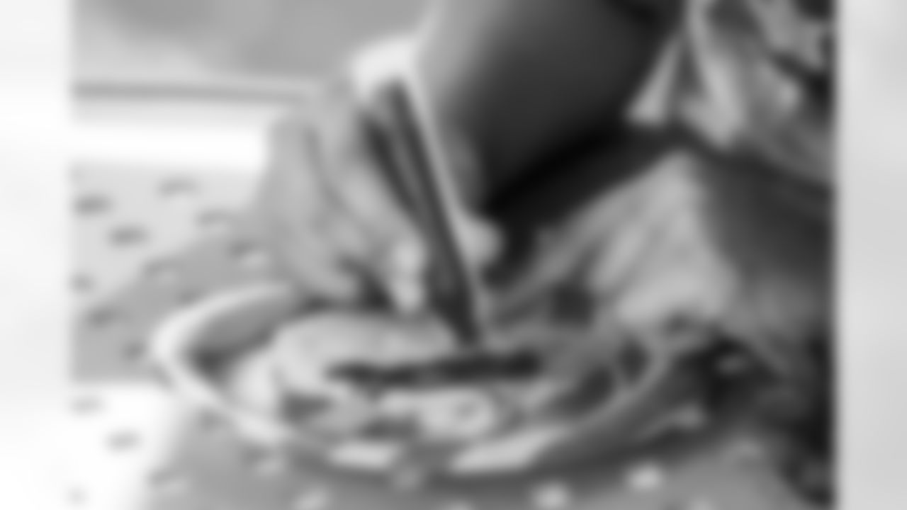 TAMPA, FL - December 05, 2025 - Mike and Ashli Evans host the Mike Evans Family Foundation 'Catch for Christmas' holiday event at AdventHealth Training Center. Photo By Kyle Zedaker/Tampa Bay Buccaneers