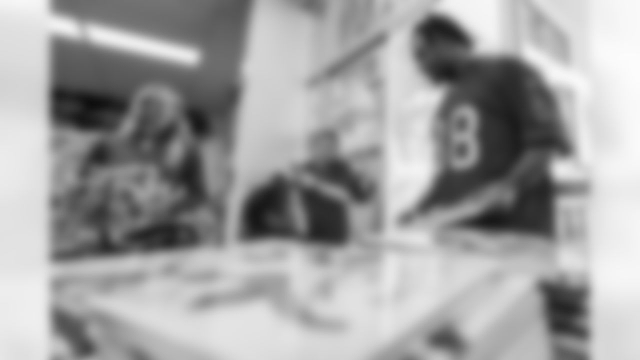 TAMPA, FL - March 03, 2026 - Safety Rashad Wisdom #38 of the Tampa Bay Buccaneers and Tampa Bay Buccaneers Cheerleaders during the National Reading Month celebration hosted by The Tampa Bay Buccaneers and Dr. Seuss Enterprises at Potter Elementary School. Photo By Doug DeFelice/Tampa Bay Buccaneers