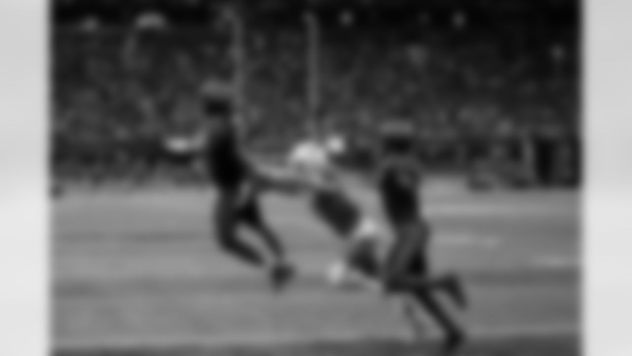 Virginia Tech wide receiver Ayden Greene (0) pushes South Carolina defensive back Brandon Cisse (15) out of the way of the pass during an NCAA college football game, Sunday, Aug. 31, 2025, in Atlanta. (AP Photo/Brynn Anderson)