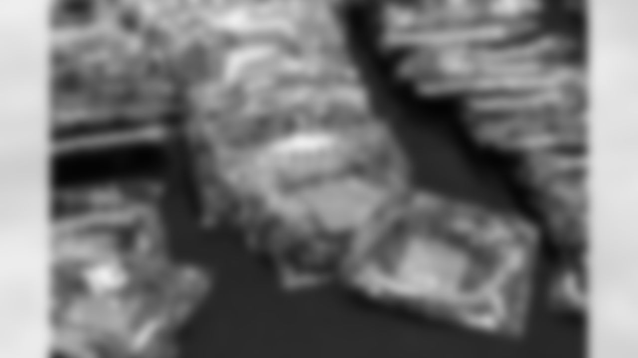 TAMPA, FL - December 06, 2025 - Set up for the She is Football Bayshore Walk: Raise The Flags event with Bayshore Breakfast Club and Tampa Girls Social & Wellness at Hyde House Public Studio. Photo By Mike Carlson/Tampa Bay Buccaneers