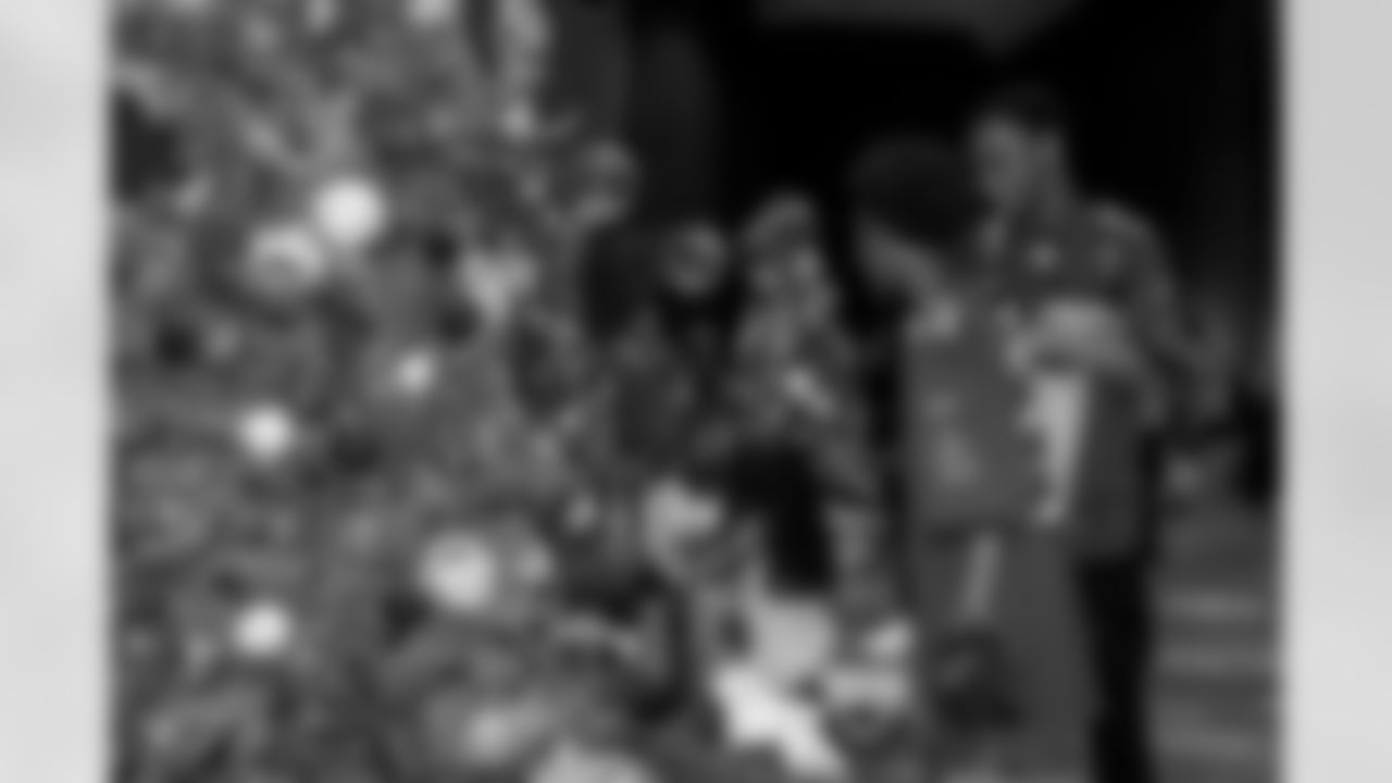 TAMPA, FL - December 05, 2025 - Mike and Ashli Evans host the Mike Evans Family Foundation 'Catch for Christmas' holiday event at AdventHealth Training Center. Photo By Kyle Zedaker/Tampa Bay Buccaneers