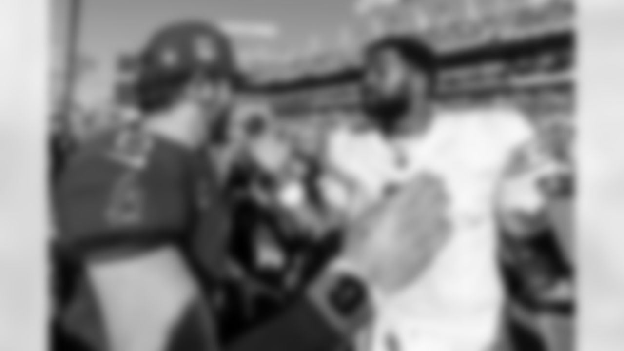 TAMPA, FL - November 30, 2025 - Quarterback Baker Mayfield #6 of the Tampa Bay Buccaneers and Jacoby Brissett after the game between the Arizona Cardinals and Tampa Bay Buccaneers. The Bucs won the game, 20-17. Photo By Doug DeFelice/Tampa Bay Buccaneers