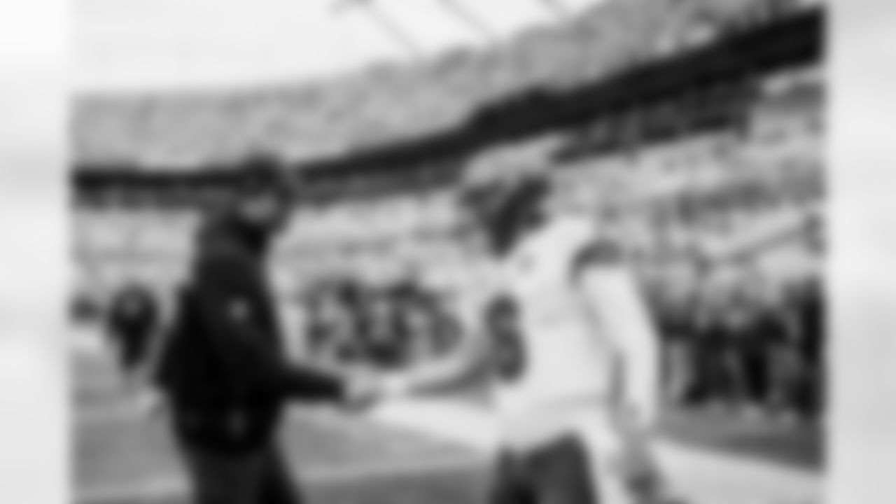 CHARLOTTE, NC - December 21, 2025 - Quarterback Baker Mayfield #6 and Run Game Coordinator/Offensive Line Coach Kevin Carberry of the Tampa Bay Buccaneers before the game between the Tampa Bay Buccaneers and Carolina Panthers. The Bucs lost the game, 23-20. Photo By Tori Richman/Tampa Bay Buccaneers