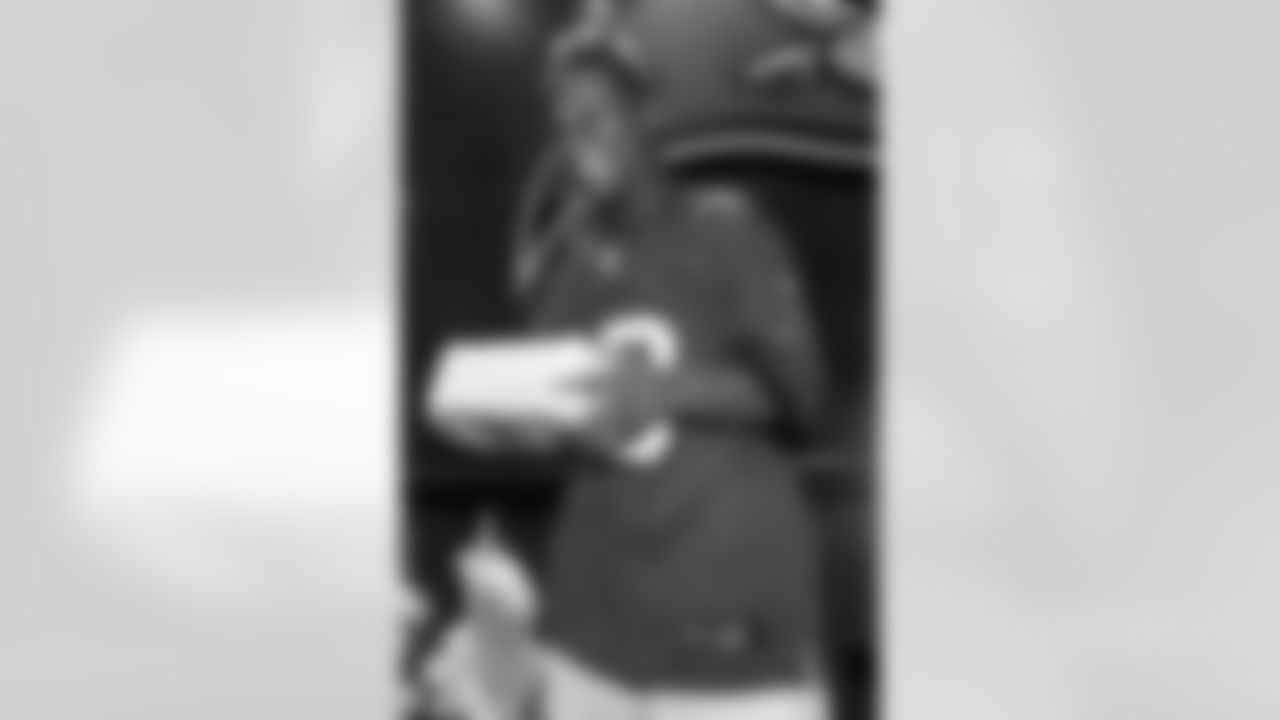 TAMPA, FL - December 05, 2025 - Mike and Ashli Evans host the Mike Evans Family Foundation 'Catch for Christmas' holiday event at AdventHealth Training Center. Photo By Kyle Zedaker/Tampa Bay Buccaneers