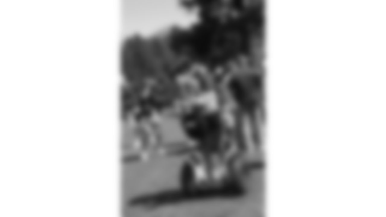 Larry Fitzgerald drives a segway around during training camp in Flagstaff.