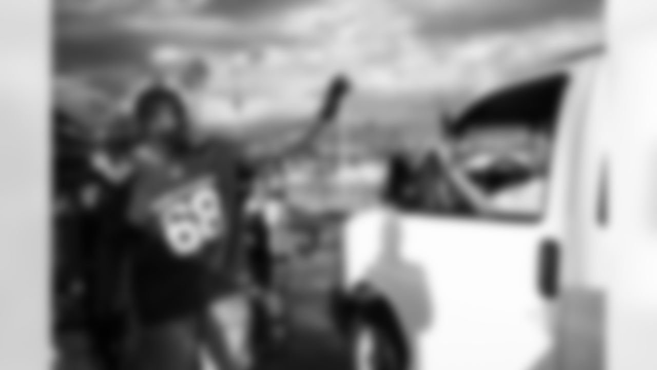 Arizona Cardinals offensive lineman Kelvin Beachum (68) and Arizona Cardinals offensive lineman Paris Johnson Jr. (70) host a food distribution for families at the Eisenhower Center for Innovation in collaboration with United Food Bank on Tuesday, Nov. 18, 2025 in Mesa, AZ.