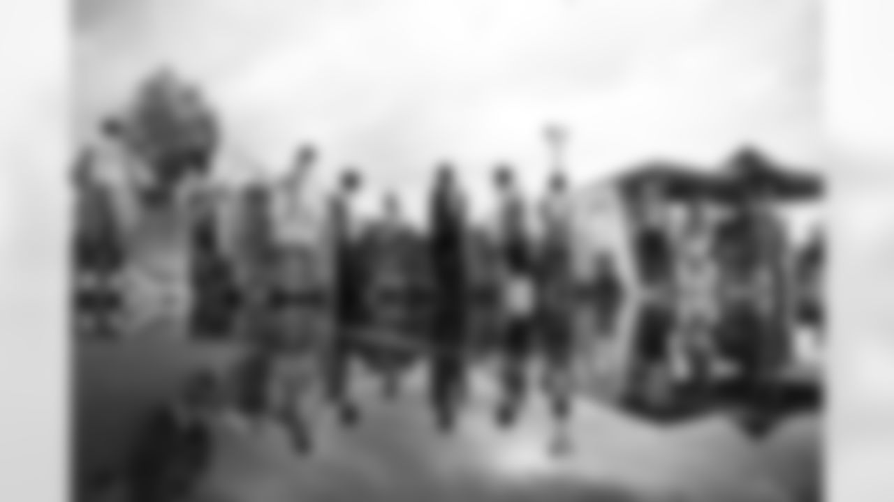 Arizona Cardinals offensive lineman Kelvin Beachum (68) and Arizona Cardinals offensive lineman Paris Johnson Jr. (70) host a food distribution for families at the Eisenhower Center for Innovation in collaboration with United Food Bank on Tuesday, Nov. 18, 2025 in Mesa, AZ.