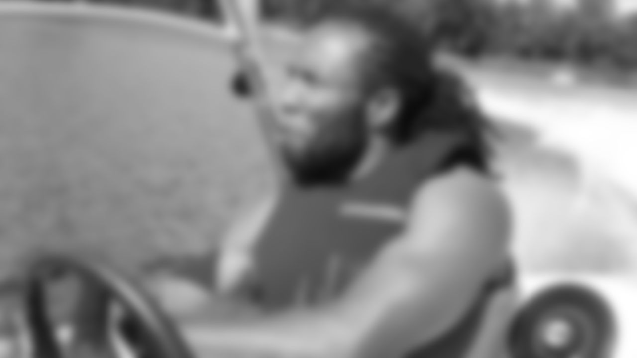 Larry Fitzgerald drives a speedboat on the lake behind his Minnesota house in 2012.