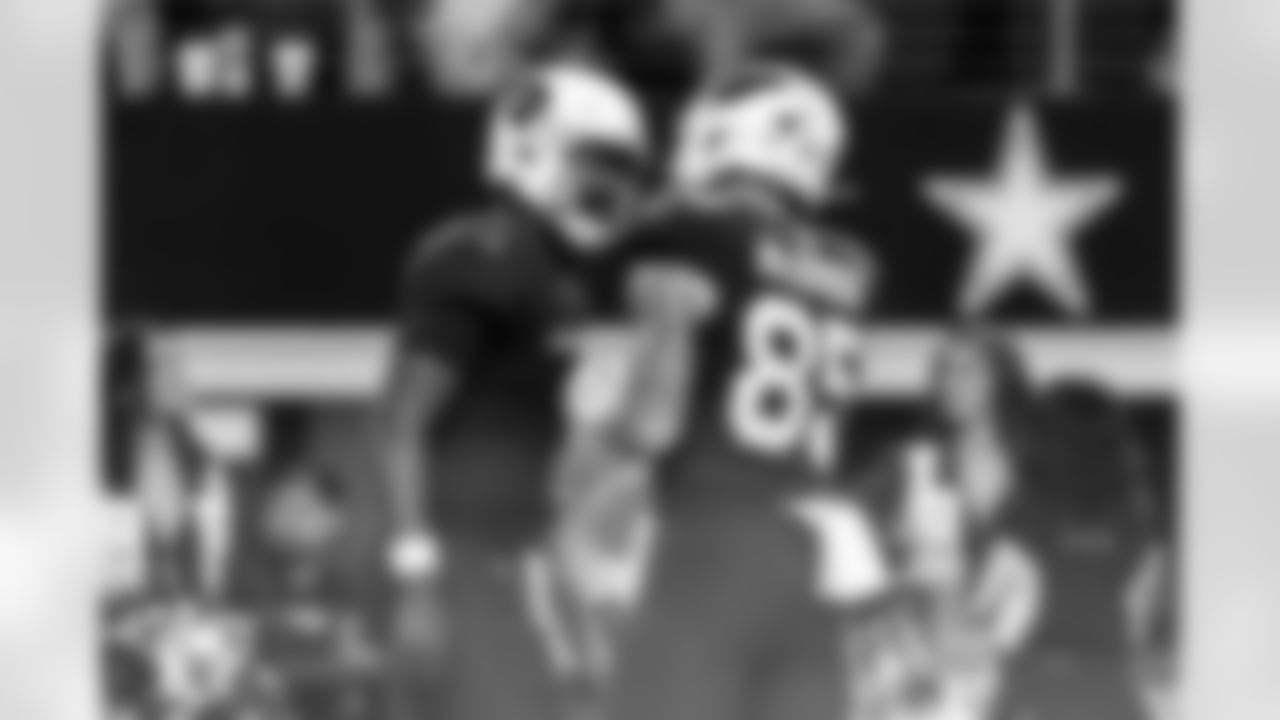 Arizona Cardinals quarterback Jacoby Brissett (7) and Arizona Cardinals tight end Trey McBride (85) during the Week 9 regular season game between the Arizona Cardinals and the Dallas Cowboys on Monday, Nov. 3, 2025 in Arlington, TX.