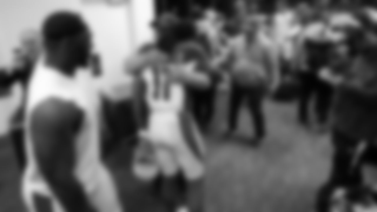 Larry Fitzgerald and Bruce Arians share a hug after Arians' final game as Cardinals coach in 2017.