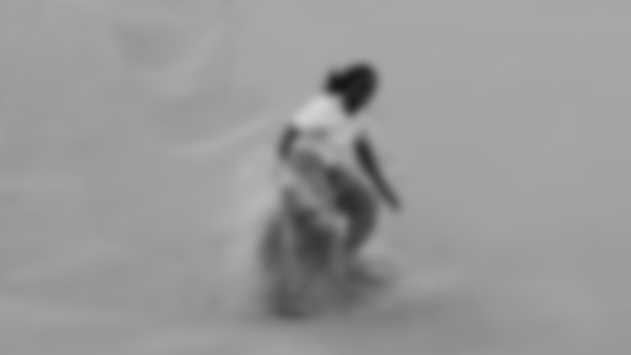 Larry Fitzgerald does some sand surfing on vacation circa 2007.