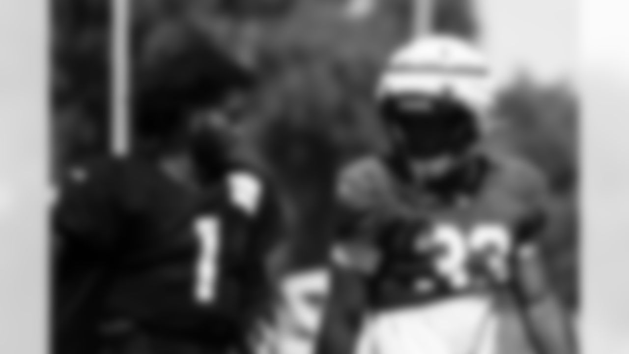 Arizona Cardinals running back Trey Benson (33) and Arizona Cardinals quarterback Kyler Murray (1) during practice at the Dignity Health Training Facility on Thursday, September 19, 2024 in Tempe, AZ.