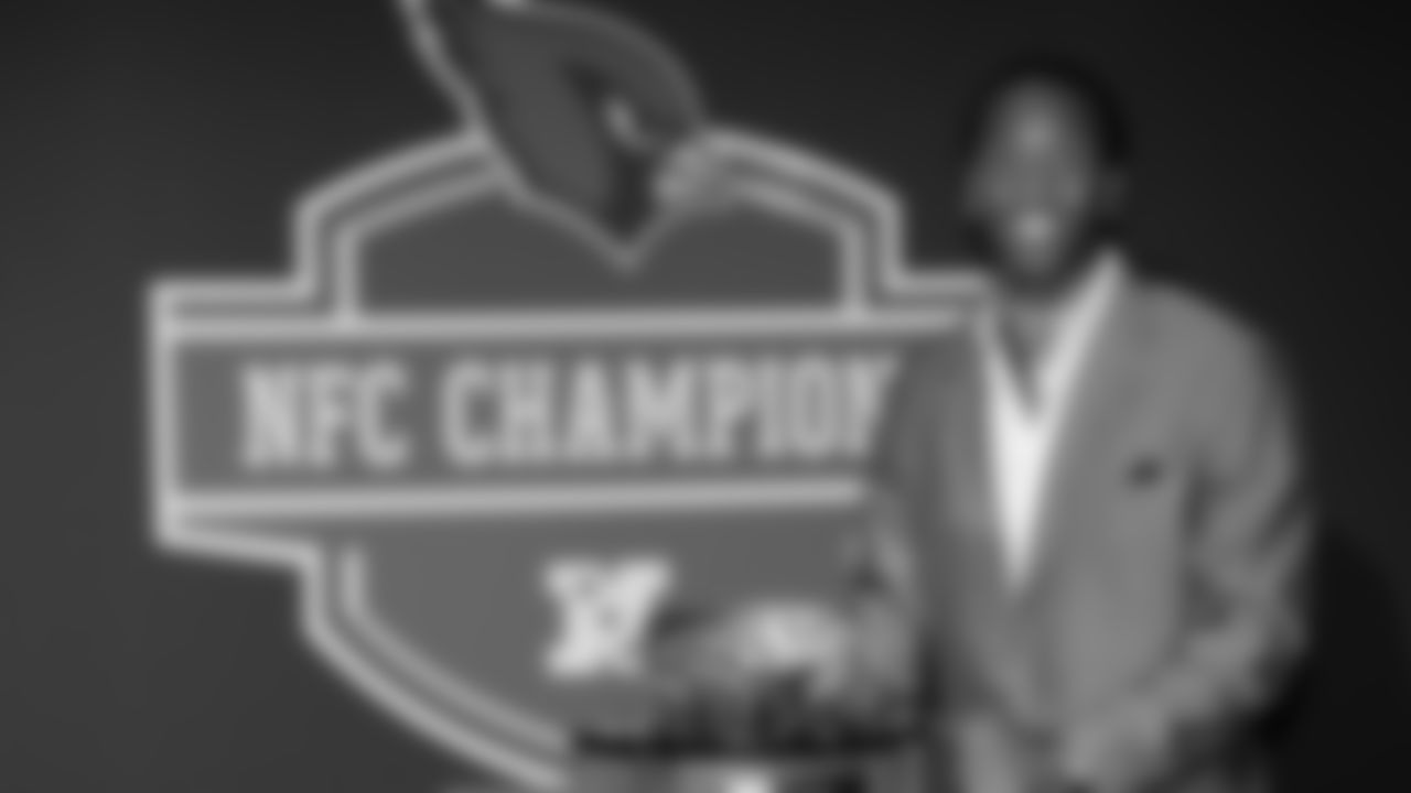 Larry Fitzgerald poses with the NFC Championship trophy during the Cardinals' ring ceremony prior to 2009 training camp.