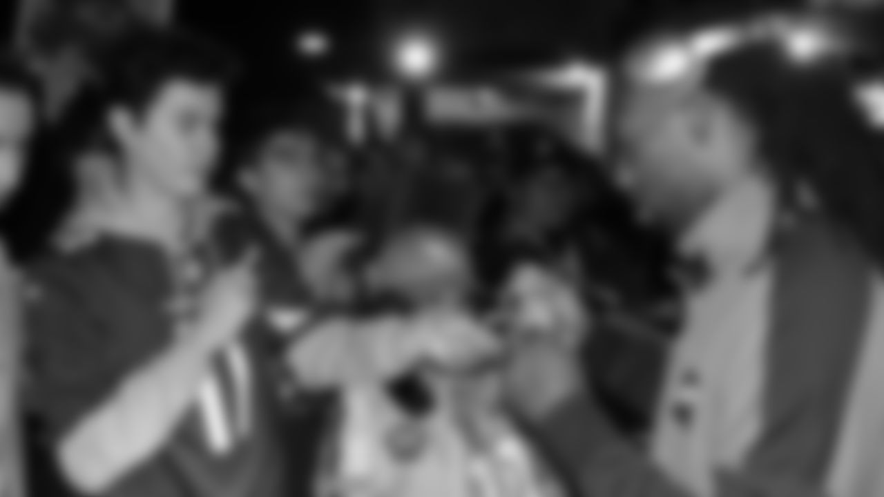 Larry Fitzgerald meets with fans after his final live Big Red Rage appearance in 2018.