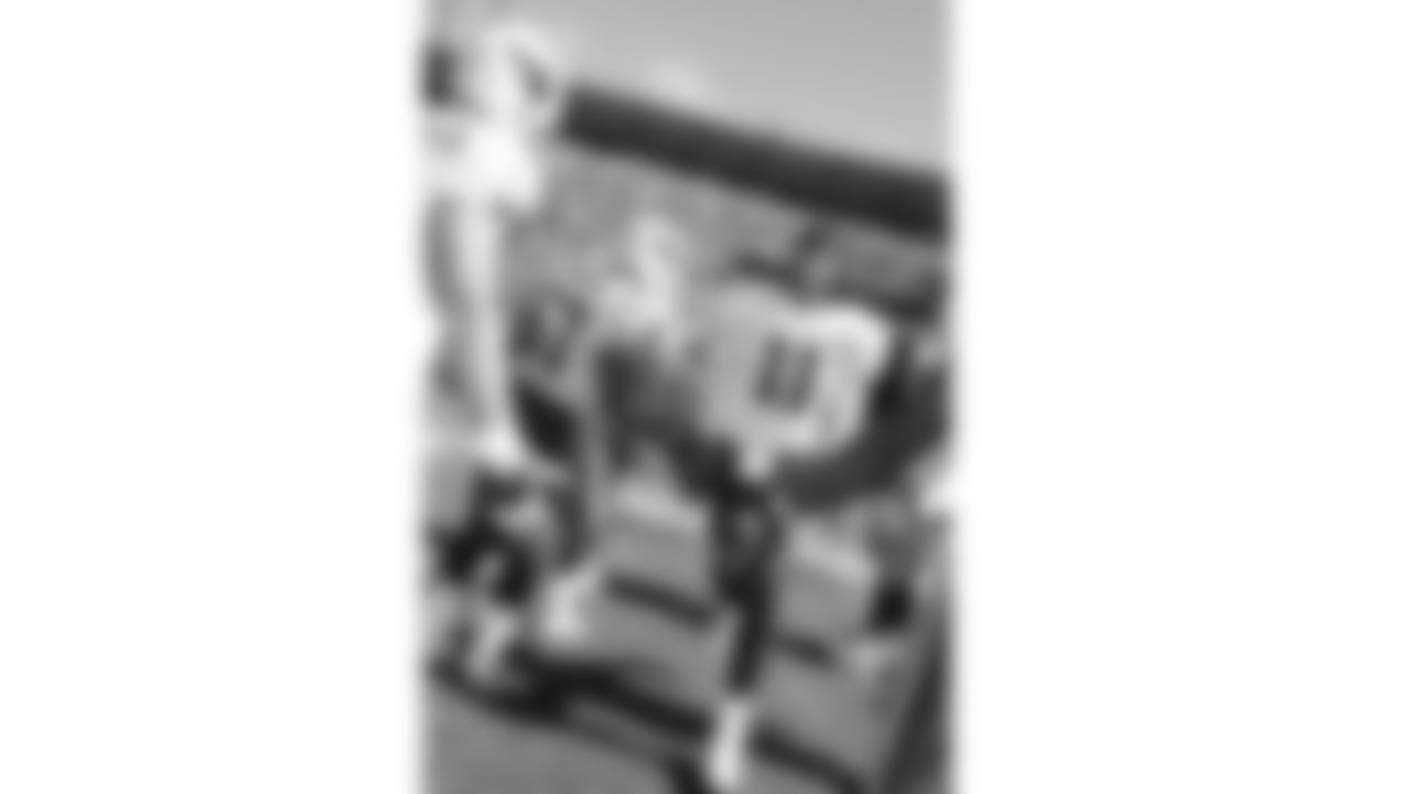 Larry Fitzgerald comes out on the field in Sun Devil Stadium before a game in his rookie season in 2004.