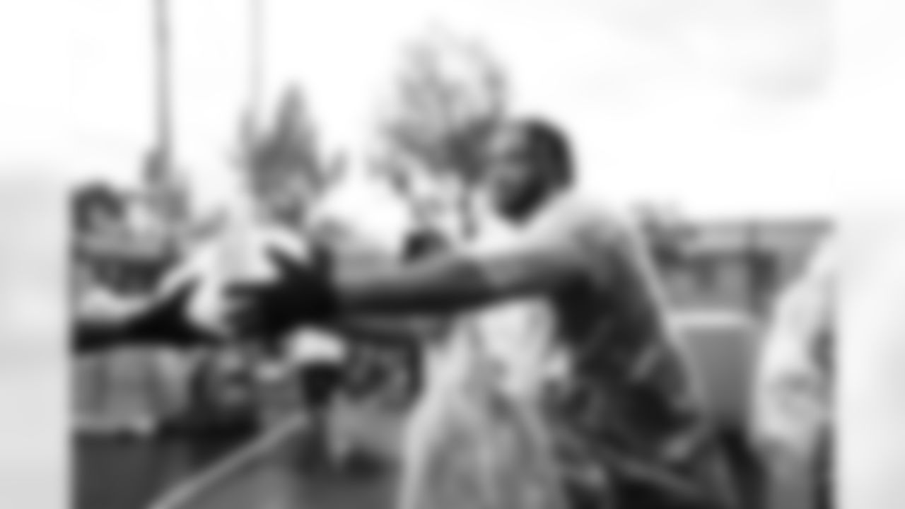 Arizona Cardinals offensive lineman Kelvin Beachum (68) and Arizona Cardinals offensive lineman Paris Johnson Jr. (70) host a food distribution for families at the Eisenhower Center for Innovation in collaboration with United Food Bank on Tuesday, Nov. 18, 2025 in Mesa, AZ.