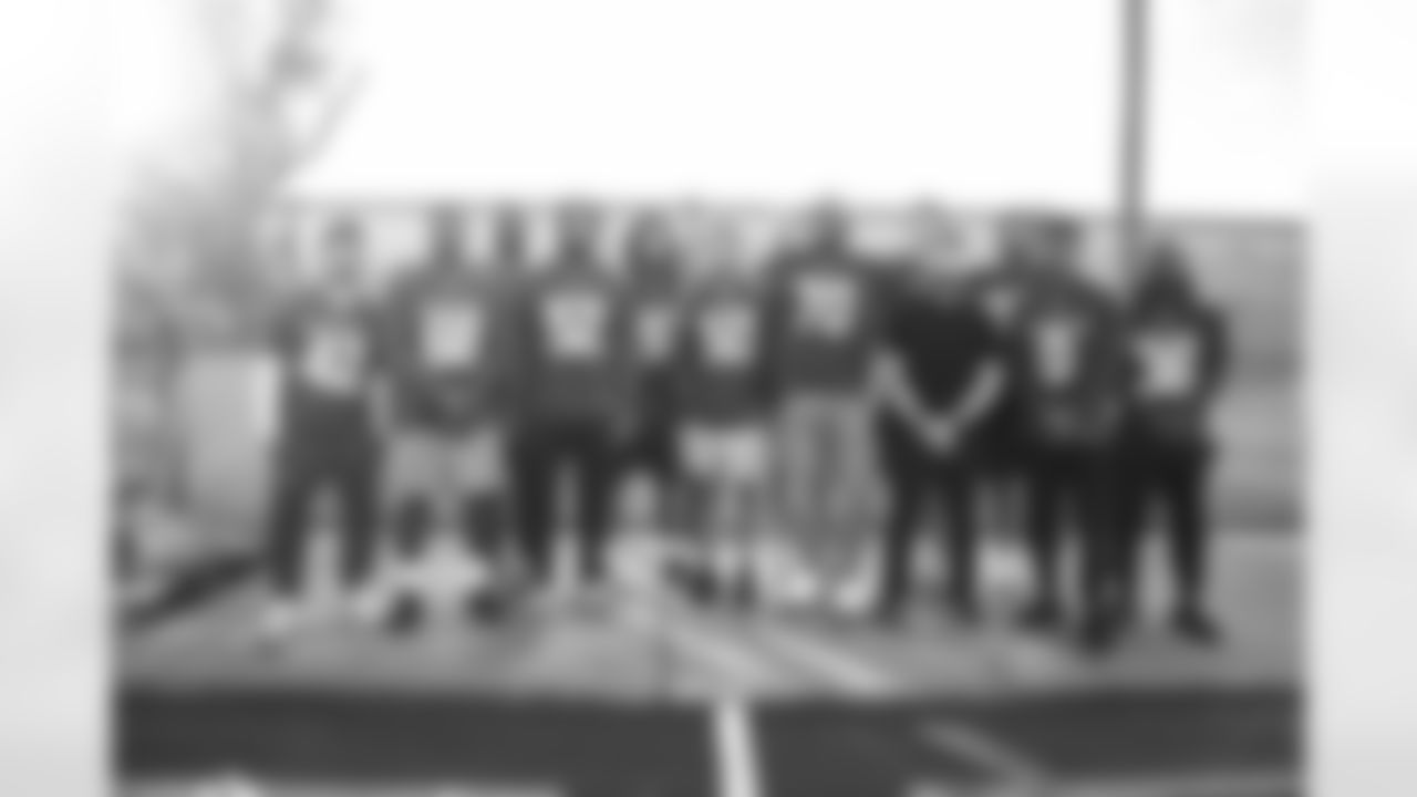 Arizona Cardinals offensive lineman Kelvin Beachum (68) and Arizona Cardinals offensive lineman Paris Johnson Jr. (70) host a food distribution for families at the Eisenhower Center for Innovation in collaboration with United Food Bank on Tuesday, Nov. 18, 2025 in Mesa, AZ.