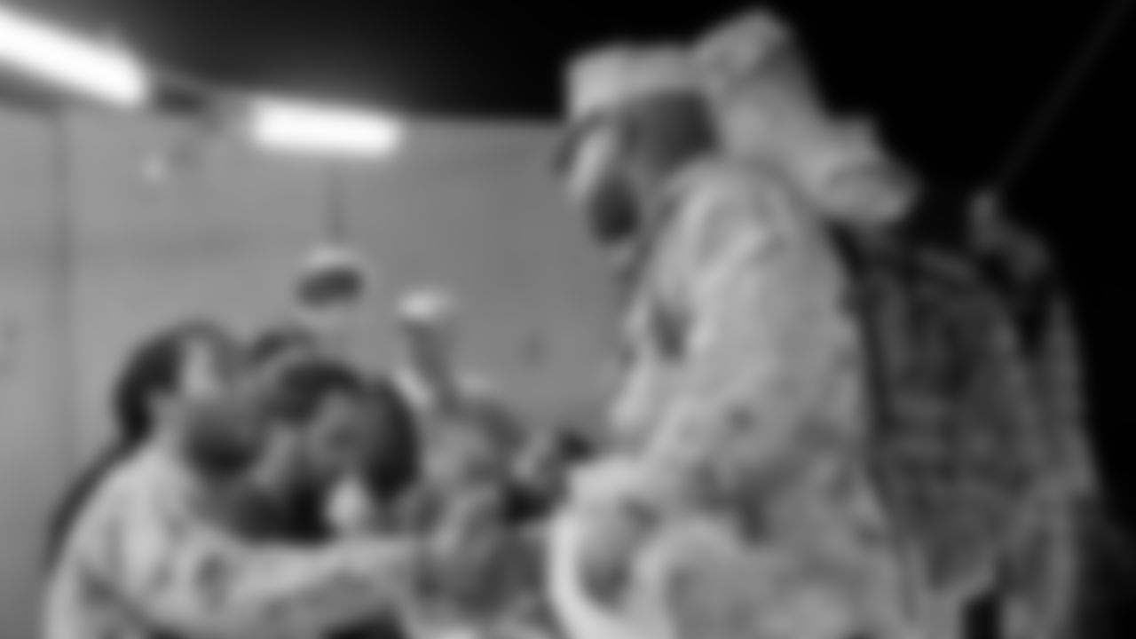 Larry Fitzgerald meets a soldier during a 2009 trip to the Middle East.