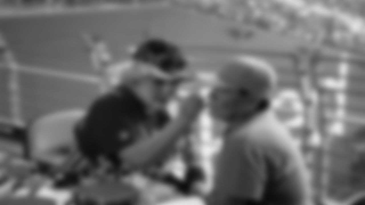 Fan Getting His Face Painted At 2023 Training Camp