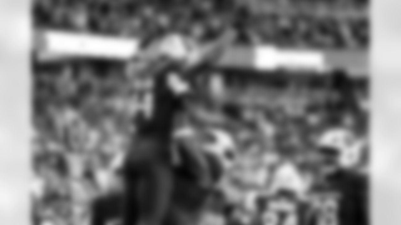 Arizona Cardinals wide receiver Michael Wilson (14) and Arizona Cardinals offensive lineman Paris Johnson Jr. (70) during the Week 14 regular season game between the Arizona Cardinals and the Los Angeles Rams on Sunday, Dec. 7, 2025 at State Farm Stadium.