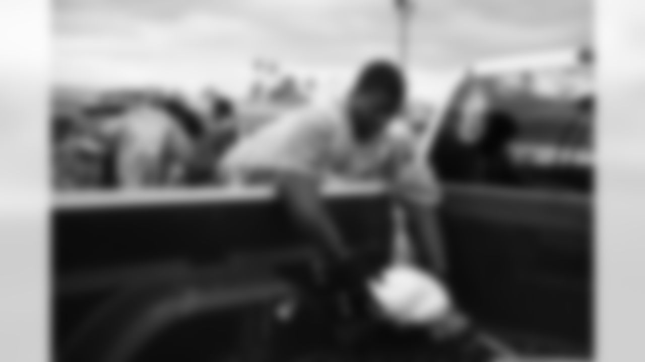 Arizona Cardinals offensive lineman Kelvin Beachum (68) and Arizona Cardinals offensive lineman Paris Johnson Jr. (70) host a food distribution for families at the Eisenhower Center for Innovation in collaboration with United Food Bank on Tuesday, Nov. 18, 2025 in Mesa, AZ.